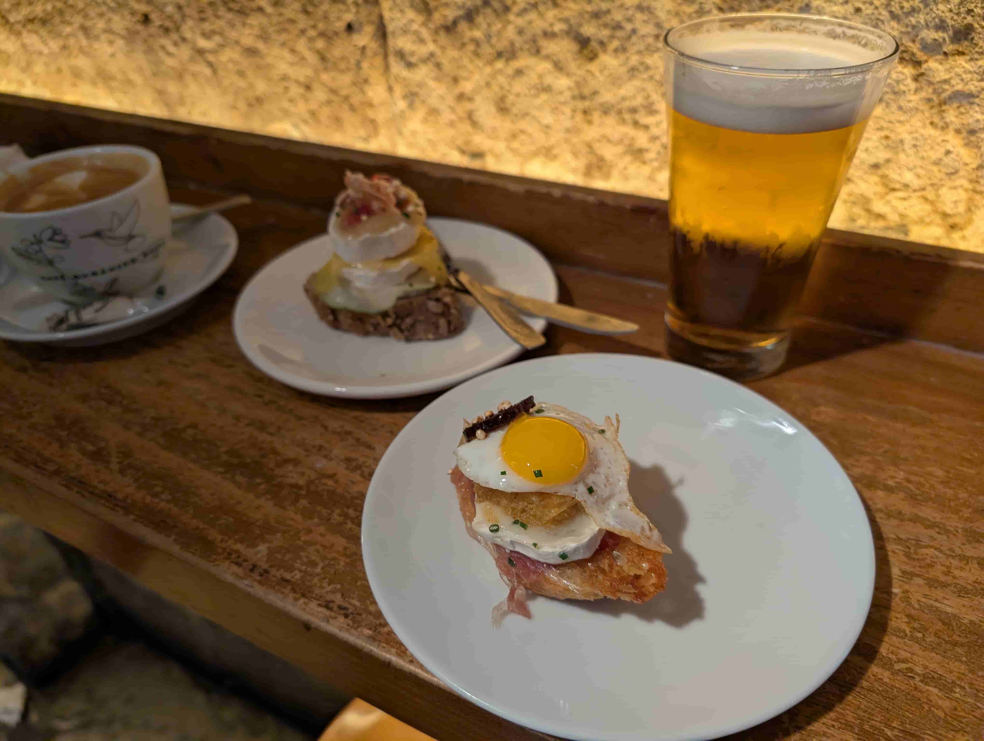 Pinxtos! Left: brie cheese, apple, jam, and mango puree. Right: quail egg, brie cheese, chorizo, and fried potato.