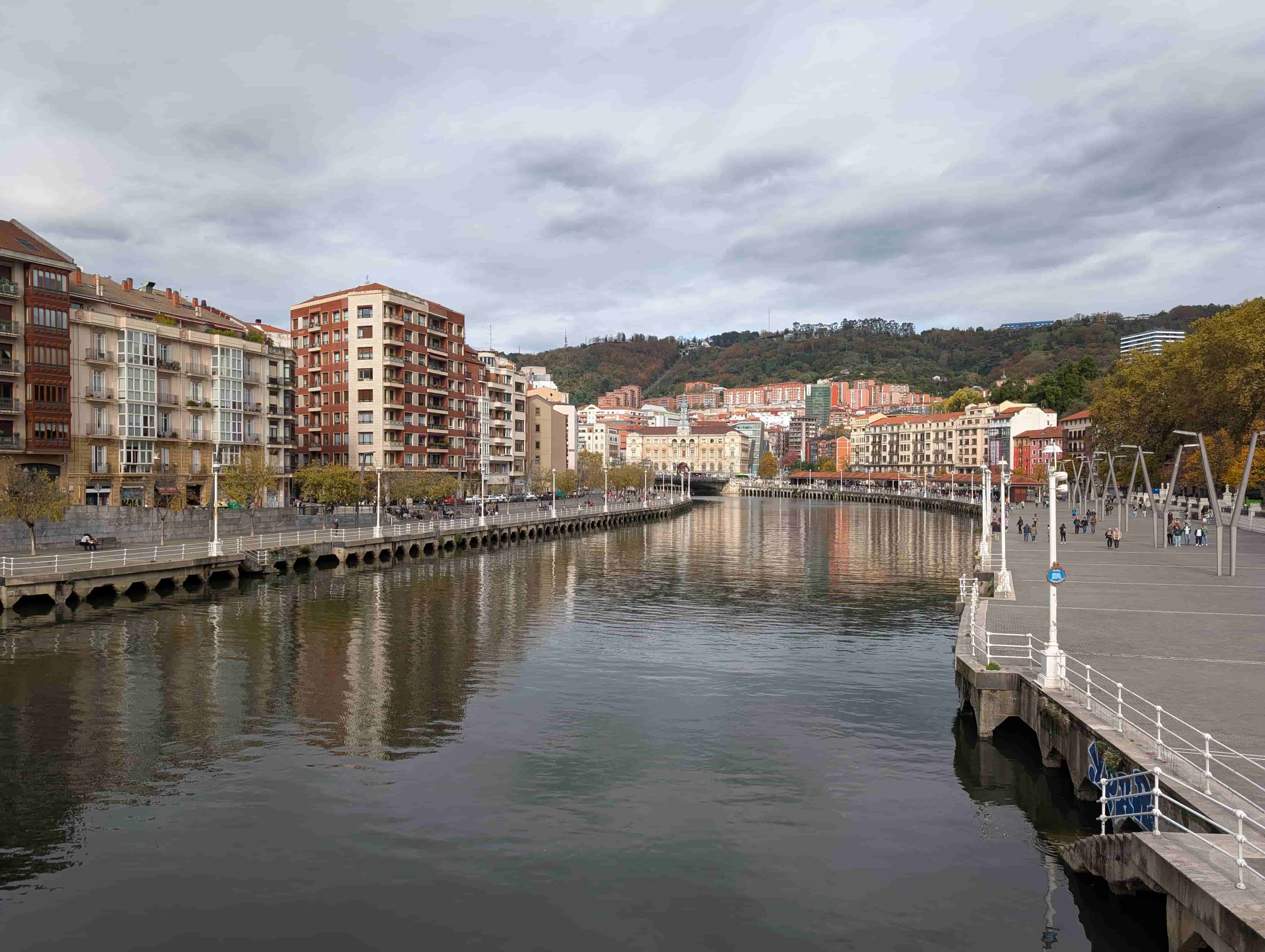 Streetlevel view of the riverfront winding through the city.